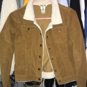 brown jean jacket with buttons and fur